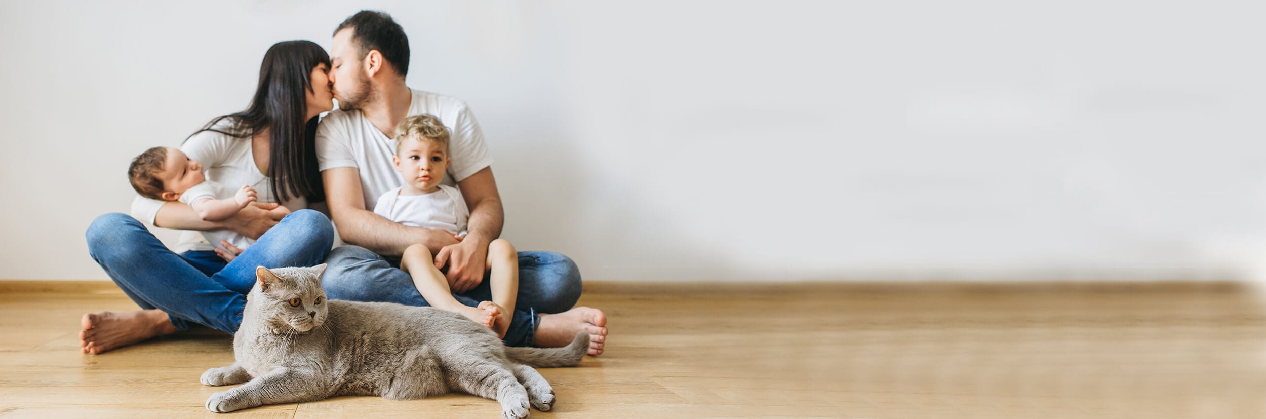 Family having just received placenta encapsulation in New Braunfels, with children and cat sitting on floor