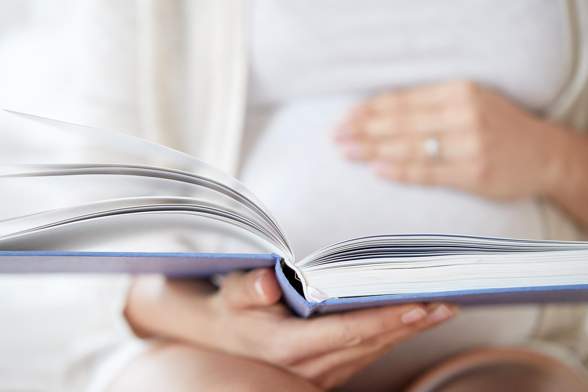 Woman reading her childbirth class book in San Antonio